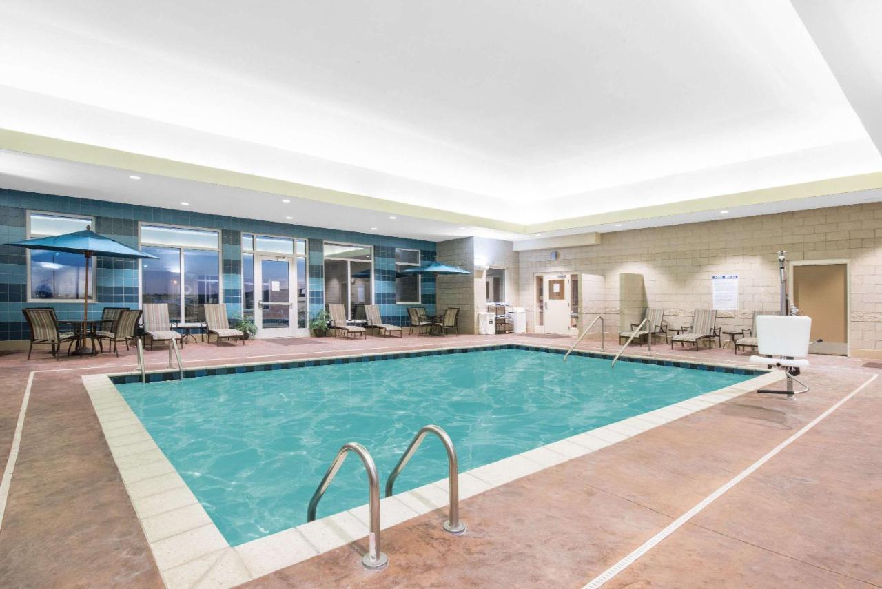 Heated swimming pool: Hawthorn Suites by Wyndham Dickinson