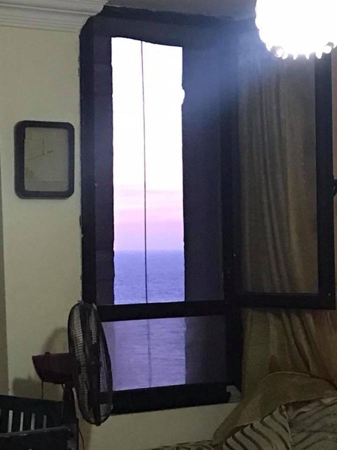 Cozy new 2 BD Amazing beach view Next to Hilton hotel Family only !العائلات فقط