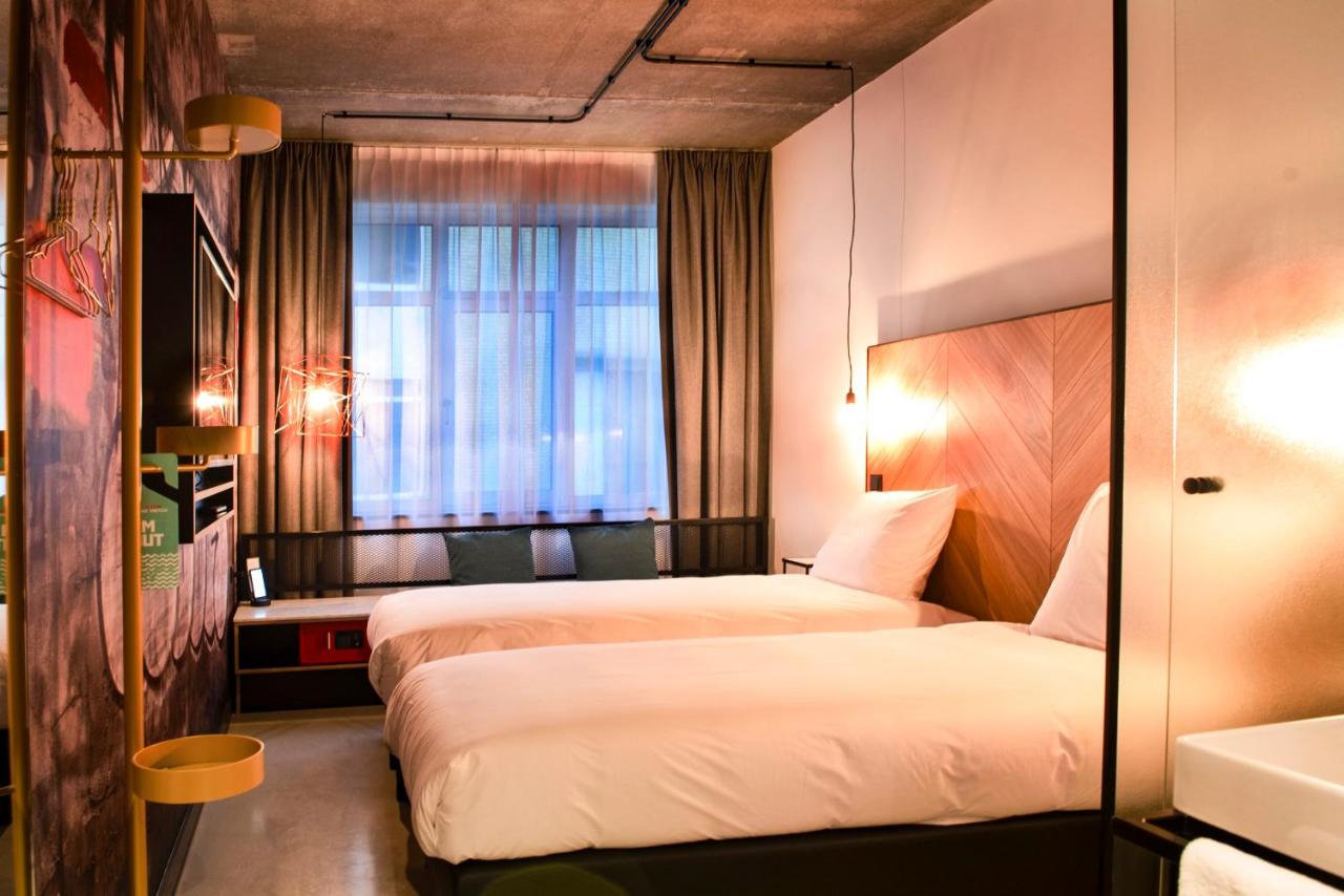 Een bed of bedden in een kamer bij Hotel the Match