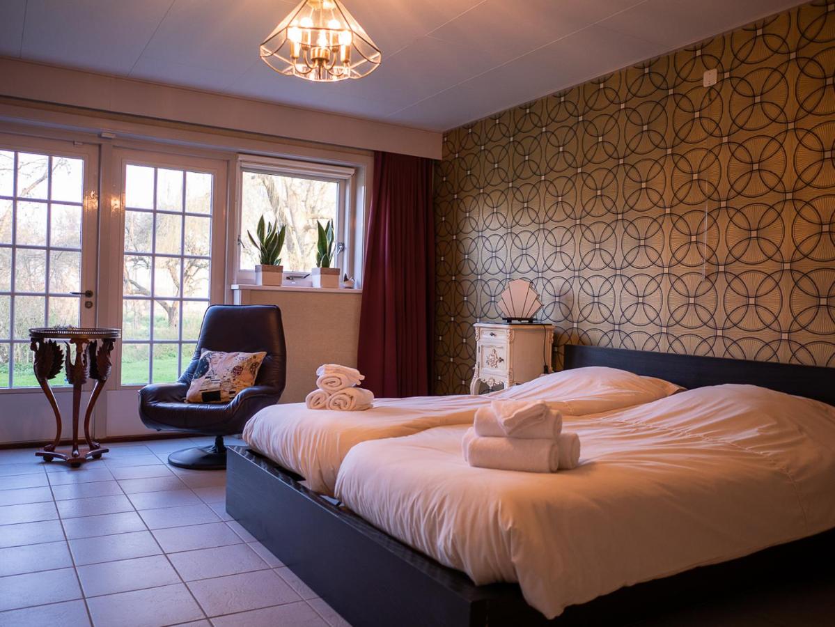 Een bed of bedden in een kamer bij De Twee Zwaluwen