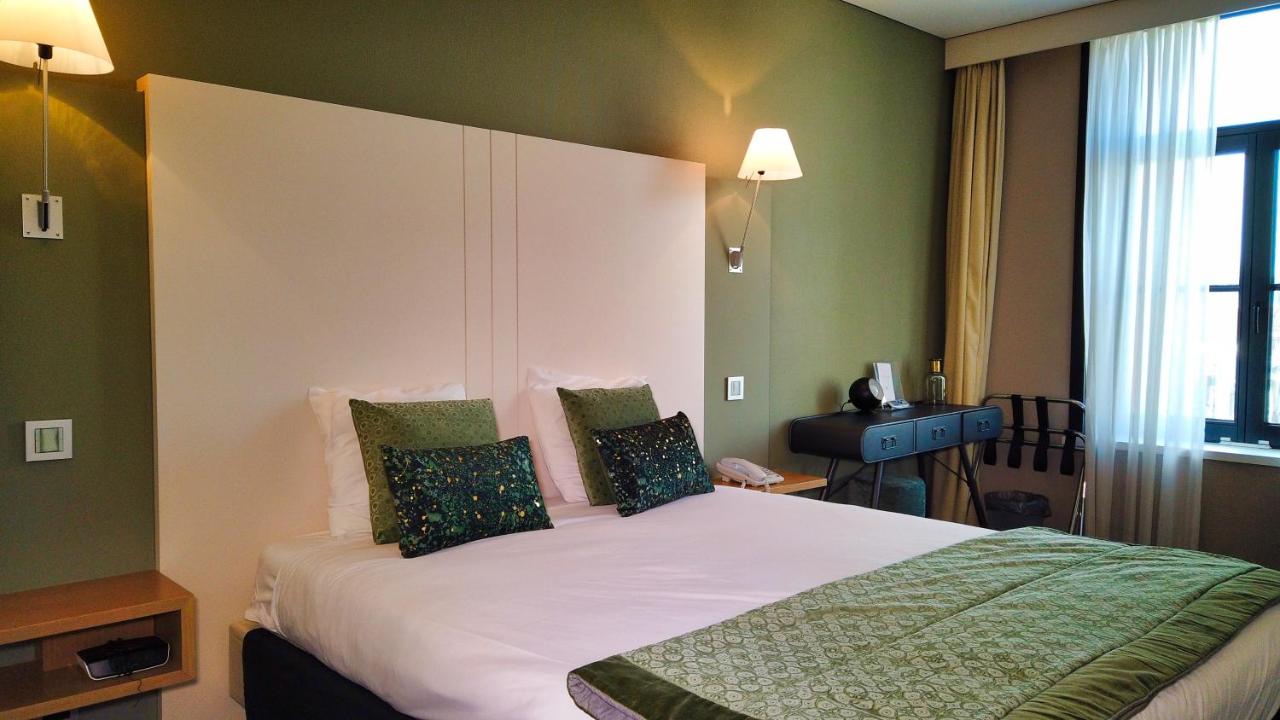 Een bed of bedden in een kamer bij Hotel Bliss
