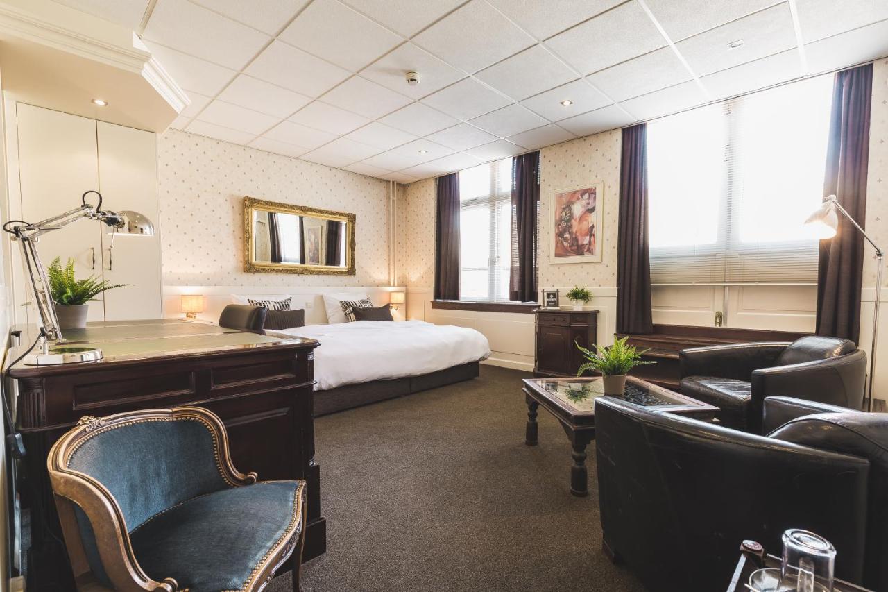 Un ou plusieurs lits dans un hébergement de l'établissement Queen Hotel
