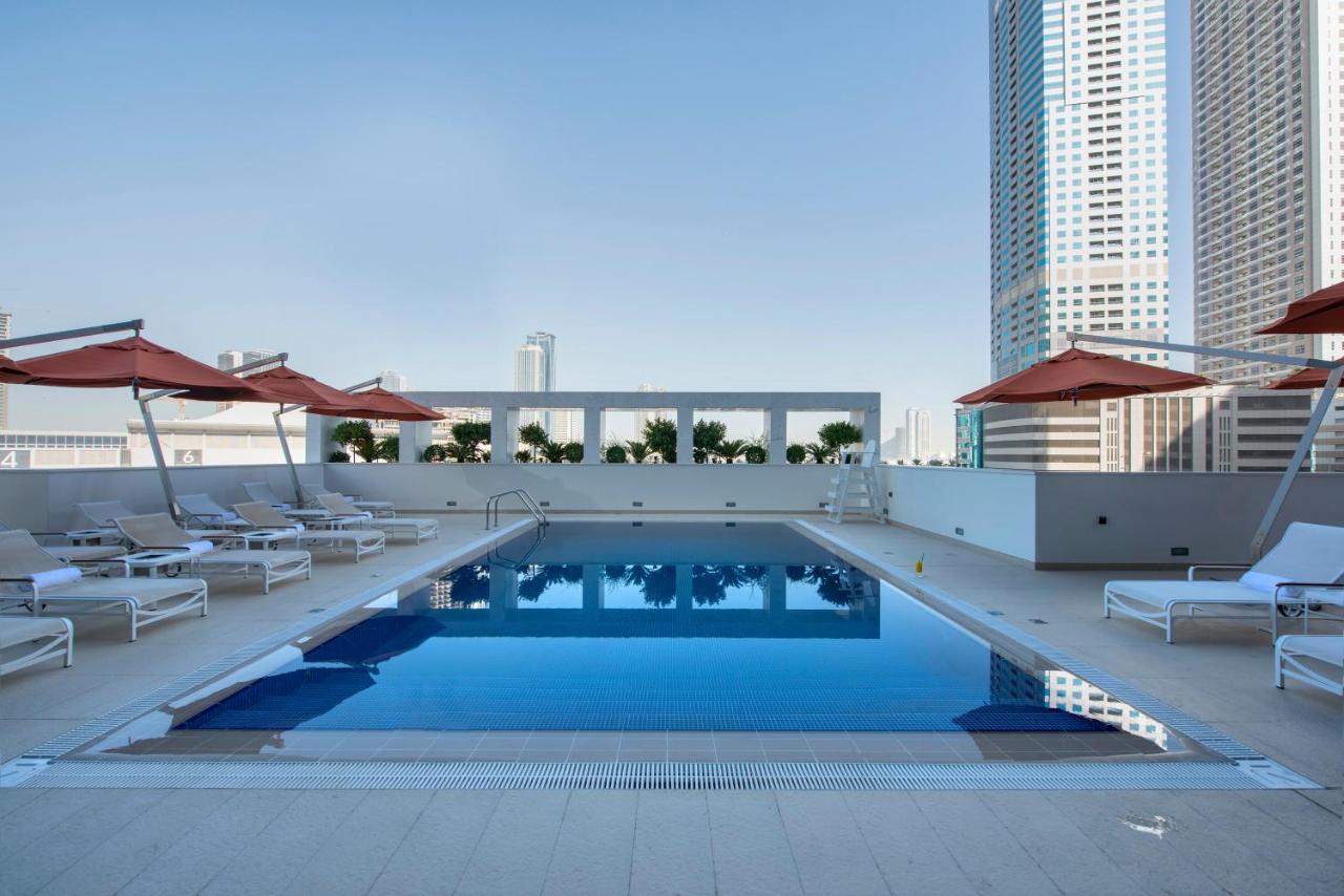 Heated swimming pool: Novotel Sharjah Expo Centre