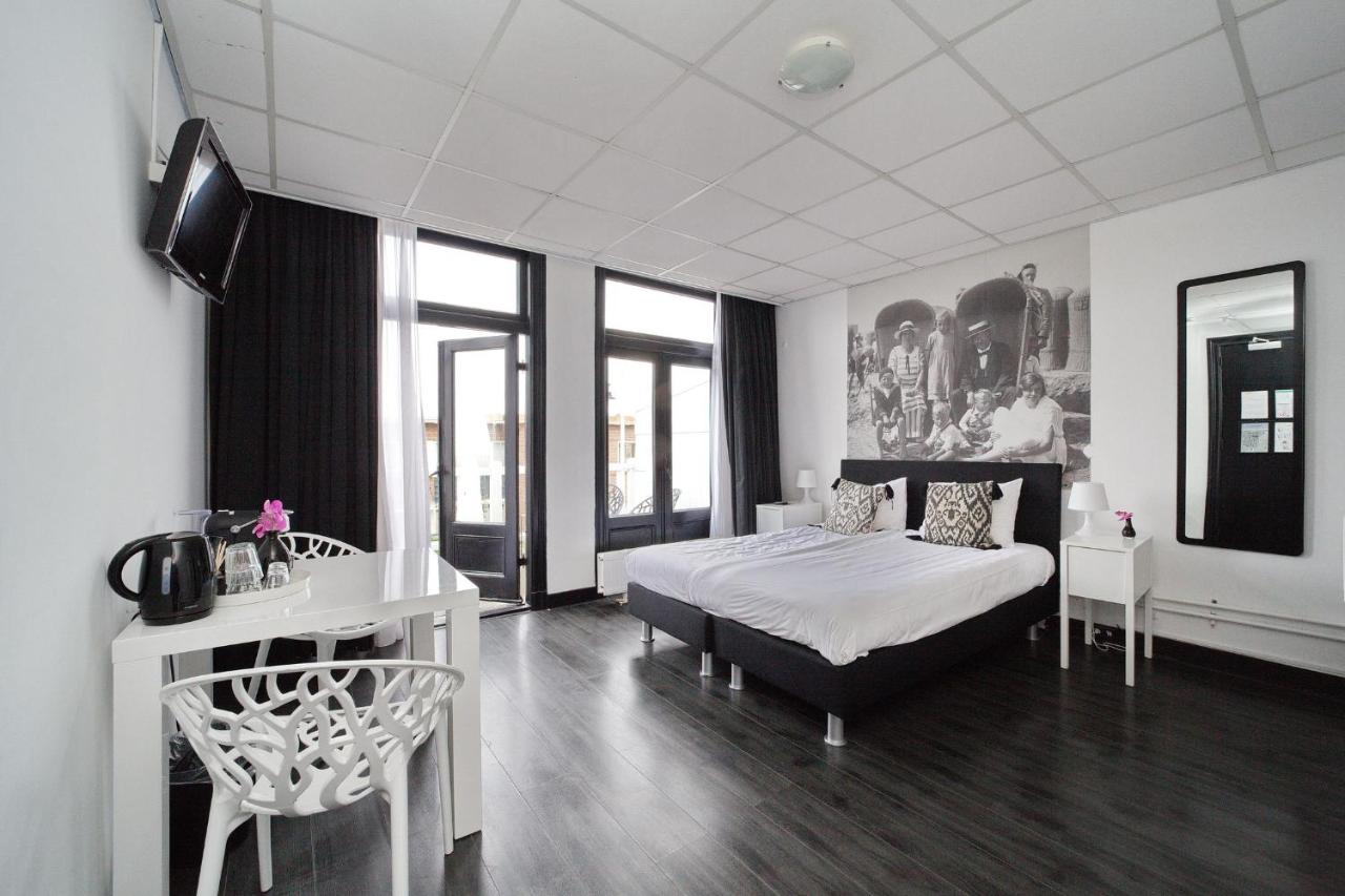 Een bed of bedden in een kamer bij Hotel Zeespiegel