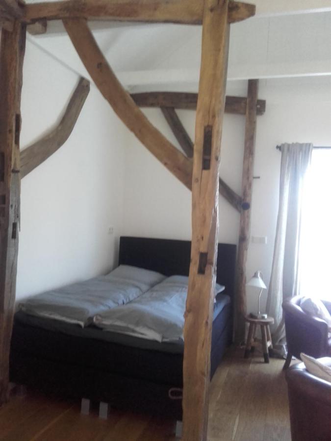 Een bed of bedden in een kamer bij Onder de Eiken