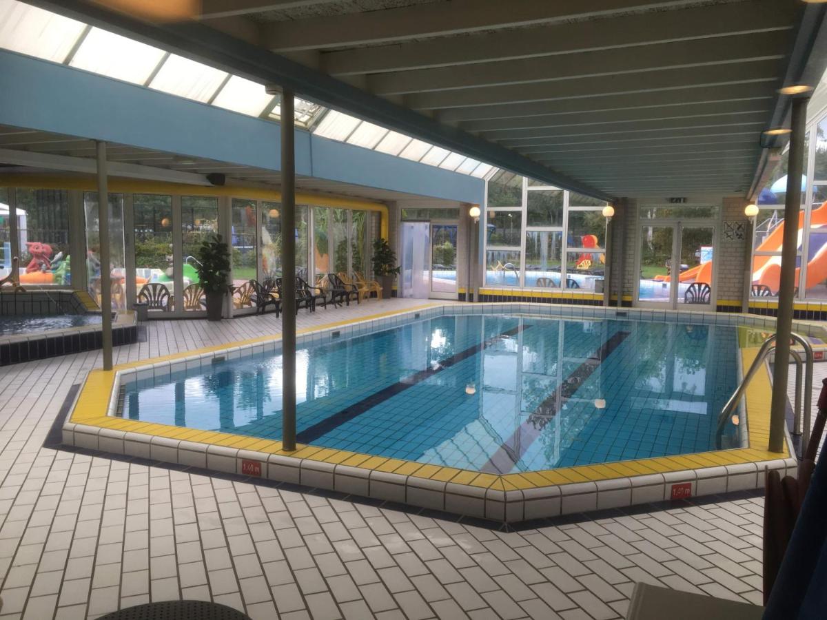 Heated swimming pool: Cedar Cottage Veluwe