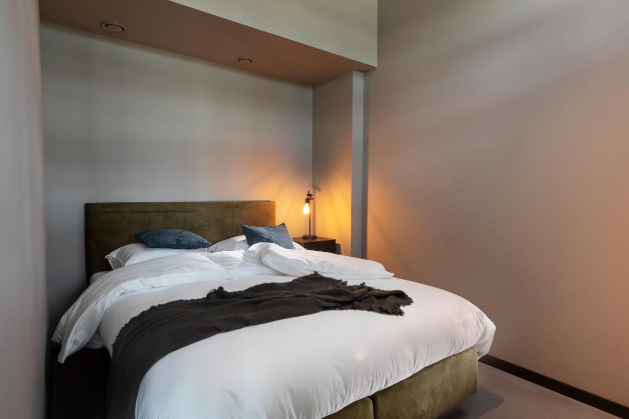 Een bed of bedden in een kamer bij Hilversum City Apartments