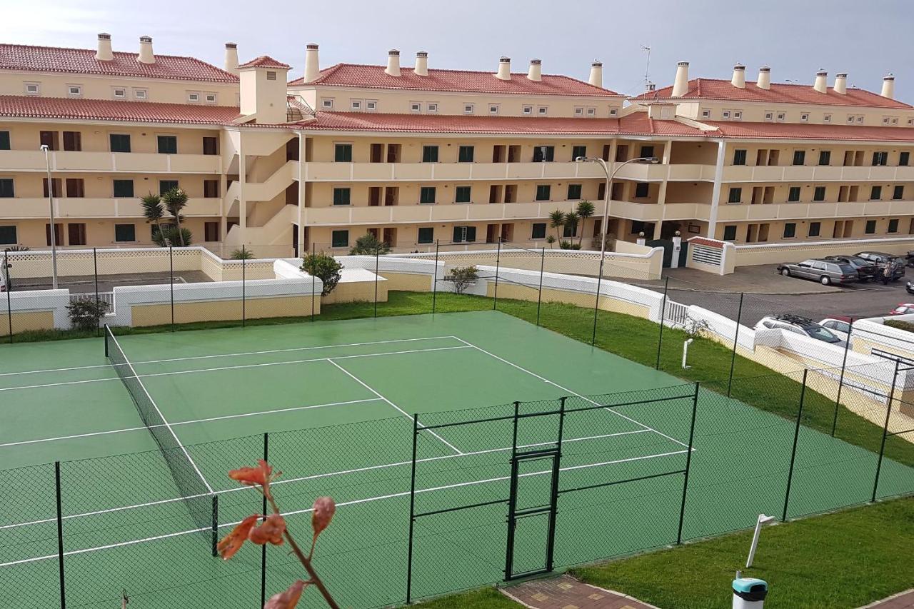 Tennis court: LovelyStay - Sea View Apartment With Pool & Garden