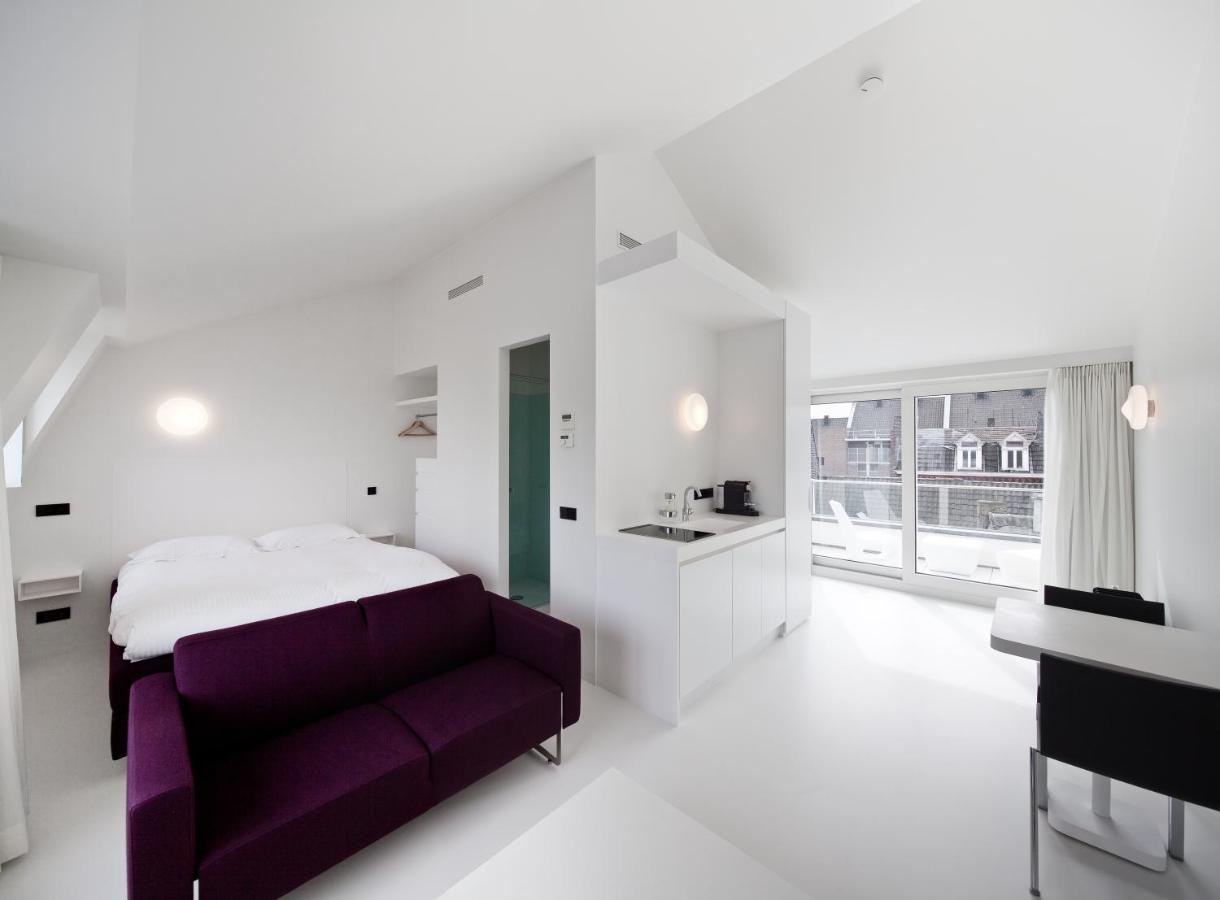 Een bed of bedden in een kamer bij Zenden Hotel Maastricht
