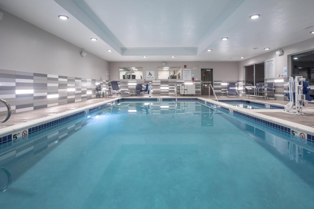 Heated swimming pool: Holiday Inn Express & Suites - Denver NE - Brighton, an IHG Hotel