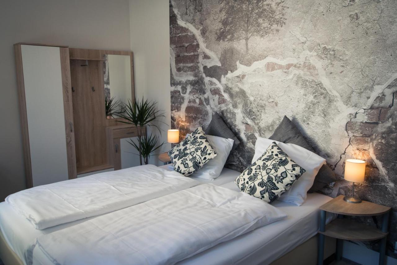 Een bed of bedden in een kamer bij Hotel Crasborn Thorn