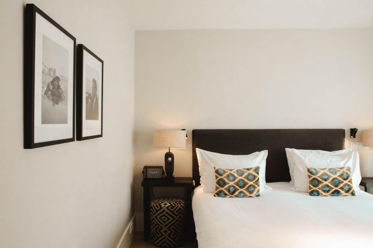 Een bed of bedden in een kamer bij Hotel FRANQ