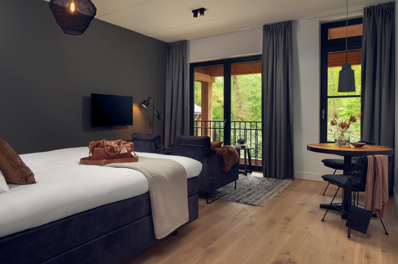 Een bed of bedden in een kamer bij Boutique Hotel Beekhuizen