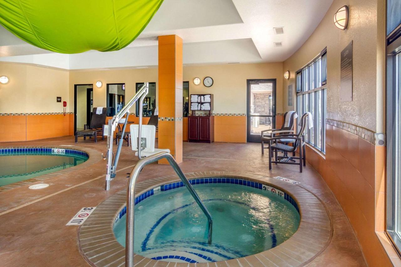 Heated swimming pool: Comfort Inn & Suites Brighton Denver NE Medical Center