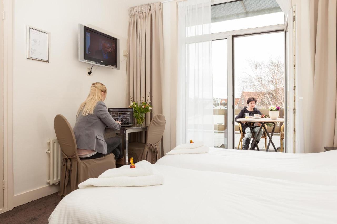 Een TV en/of entertainmentcenter bij Hotel Stad en Land 