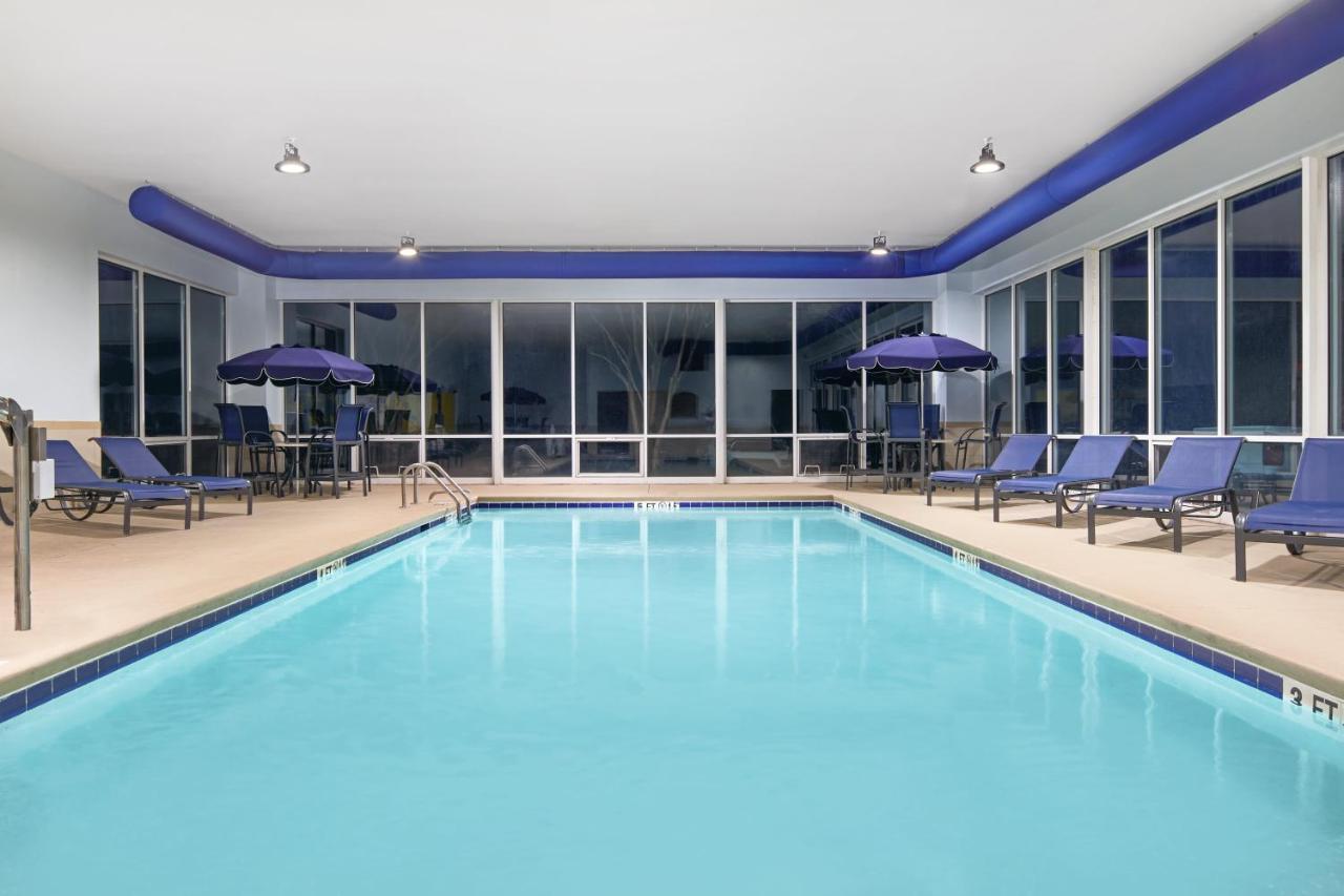 Heated swimming pool: Holiday Inn Express & Suites I-26 & Us 29 At Westgate Mall, an IHG Hotel