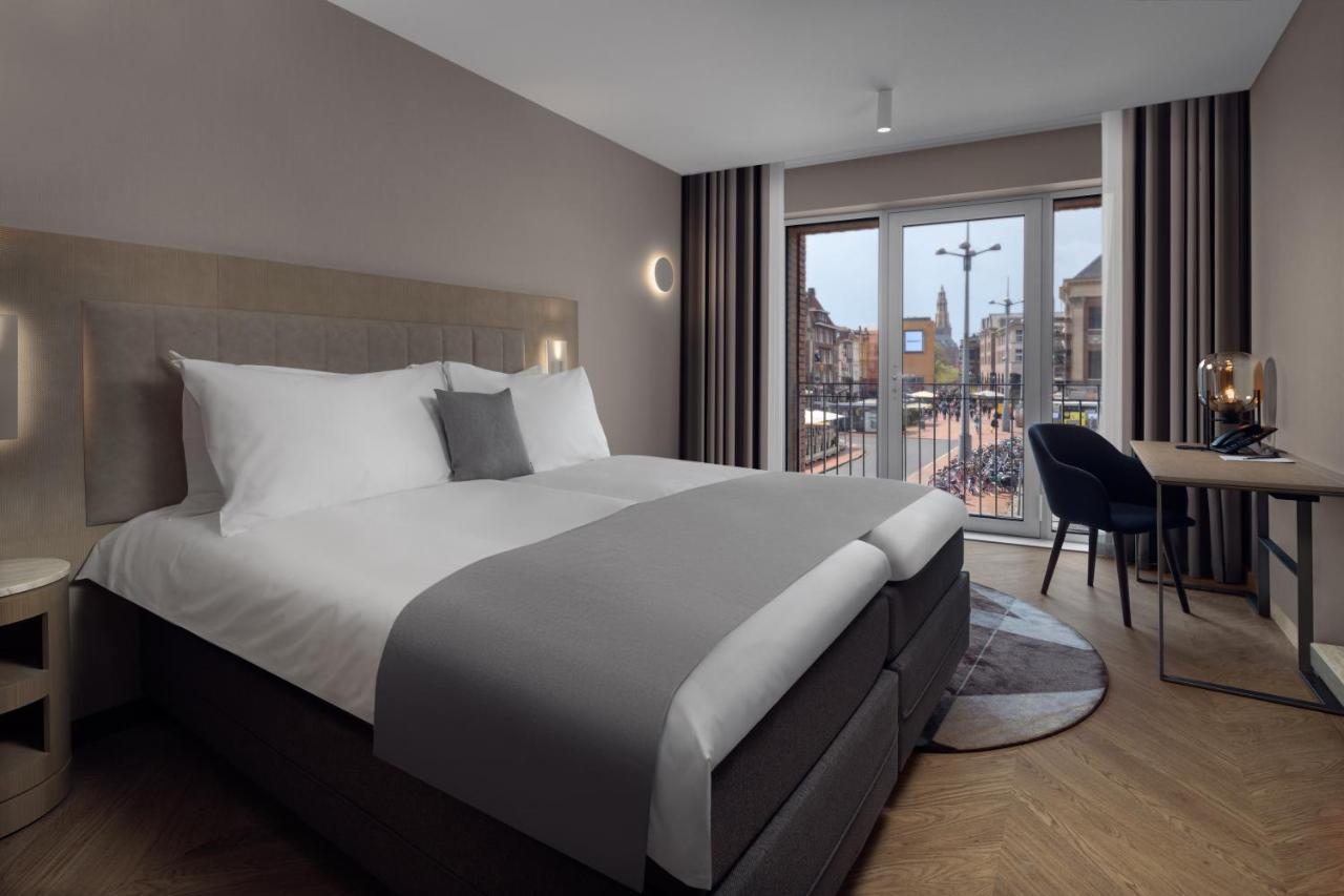 Een bed of bedden in een kamer bij The Market Hotel