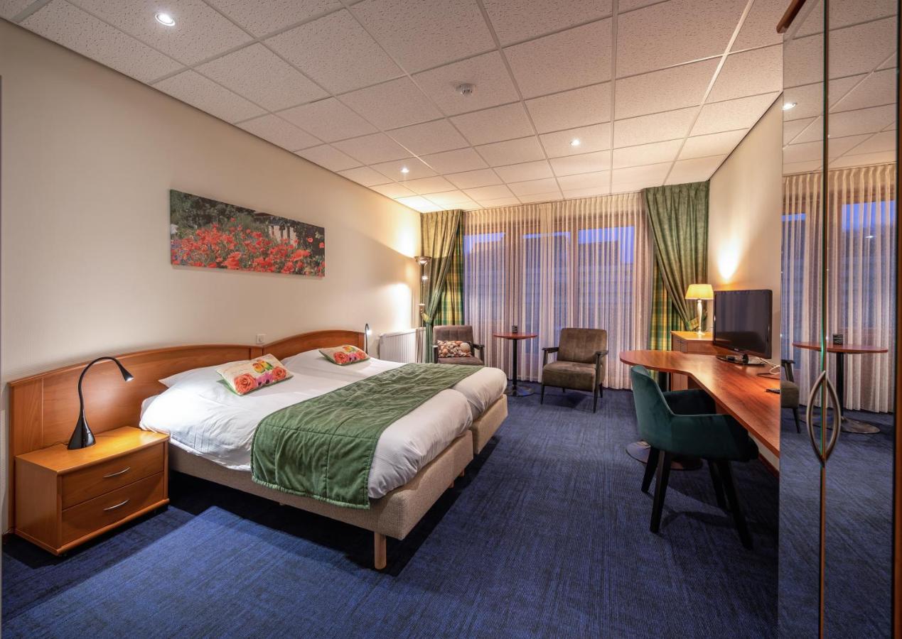 Een bed of bedden in een kamer bij Hotel de Branding