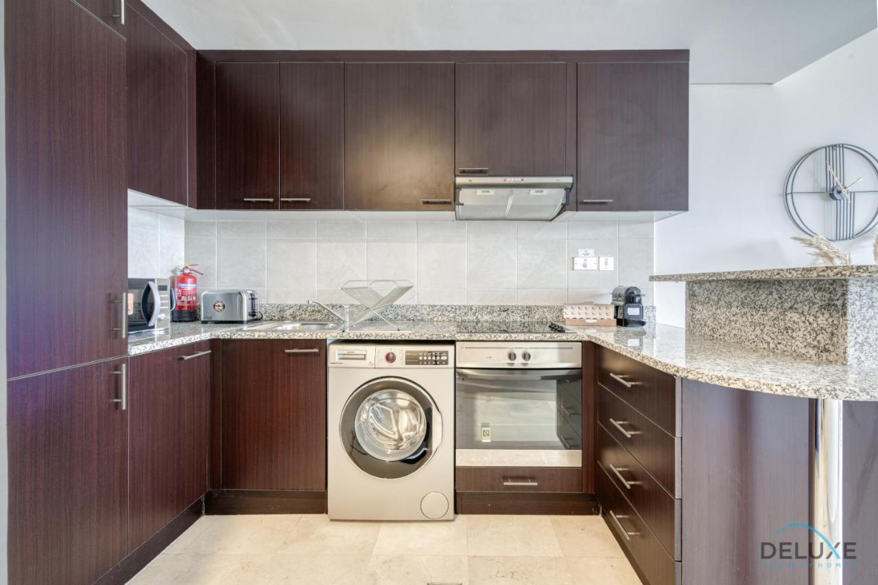 Affordable Luxury Modern 1BR with Pool & Balcony by Deluxe Holiday Homes - 4