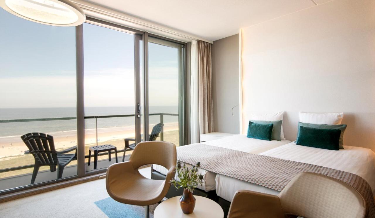 Een bed of bedden in een kamer bij Strandhotel Golfzang