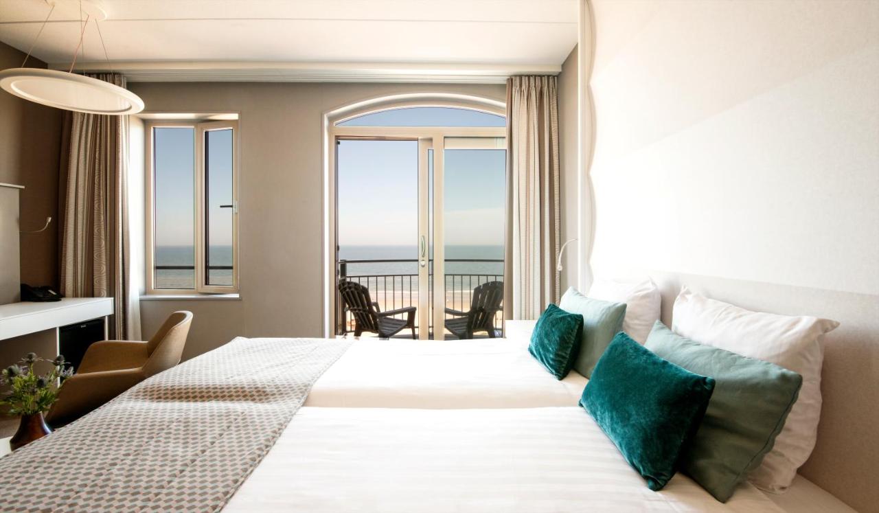 Een bed of bedden in een kamer bij Strandhotel Golfzang