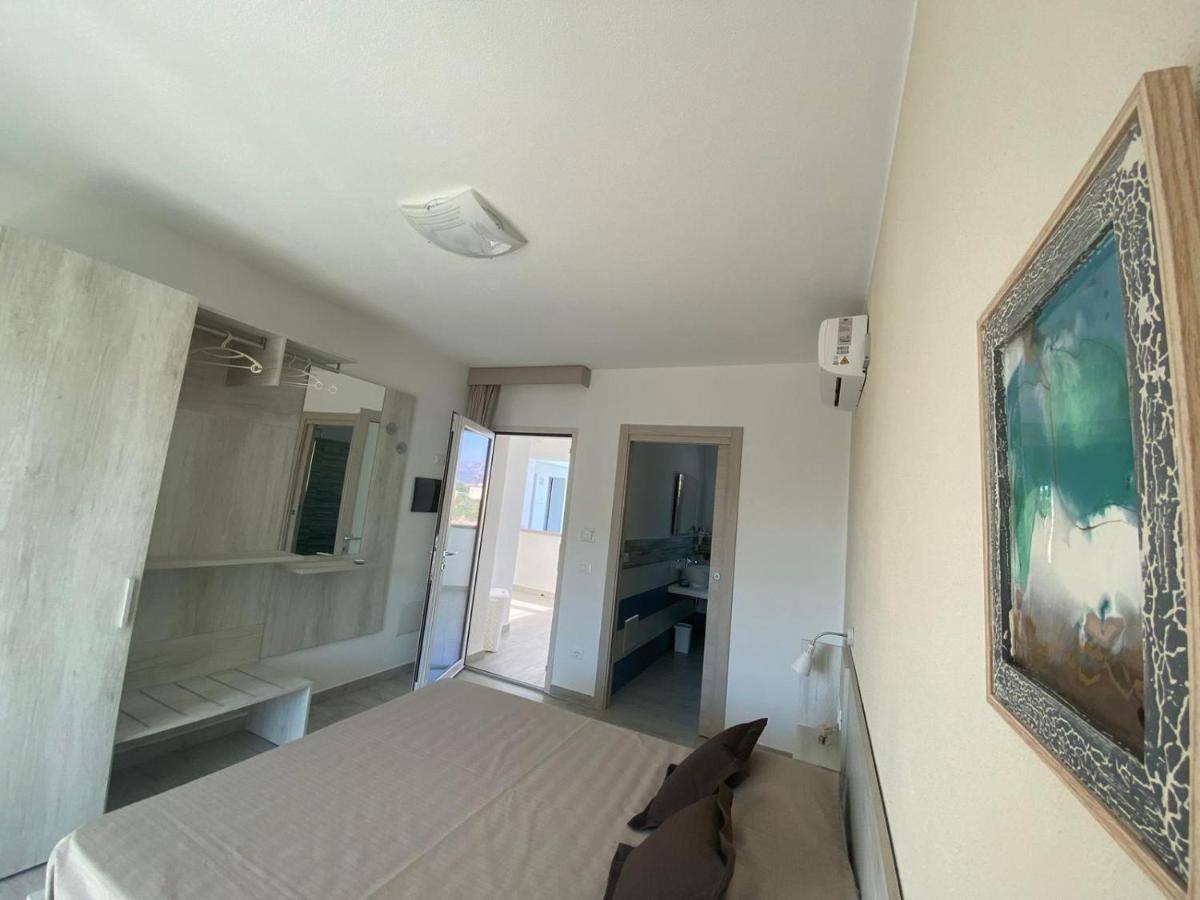 Letto o letti in una camera di Villa Lentischio
