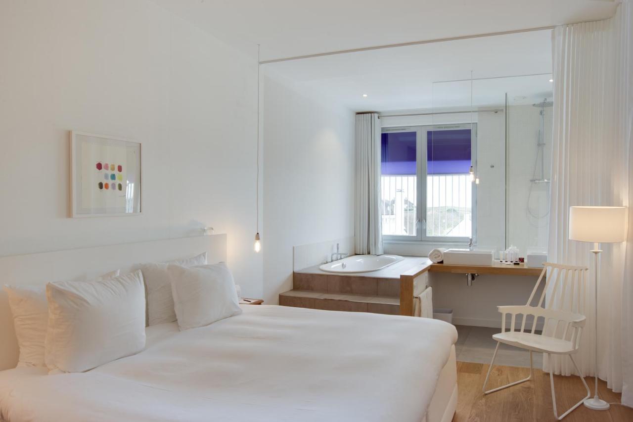 Ein Bett oder Betten in einem Zimmer der Unterkunft Vesper Hotel