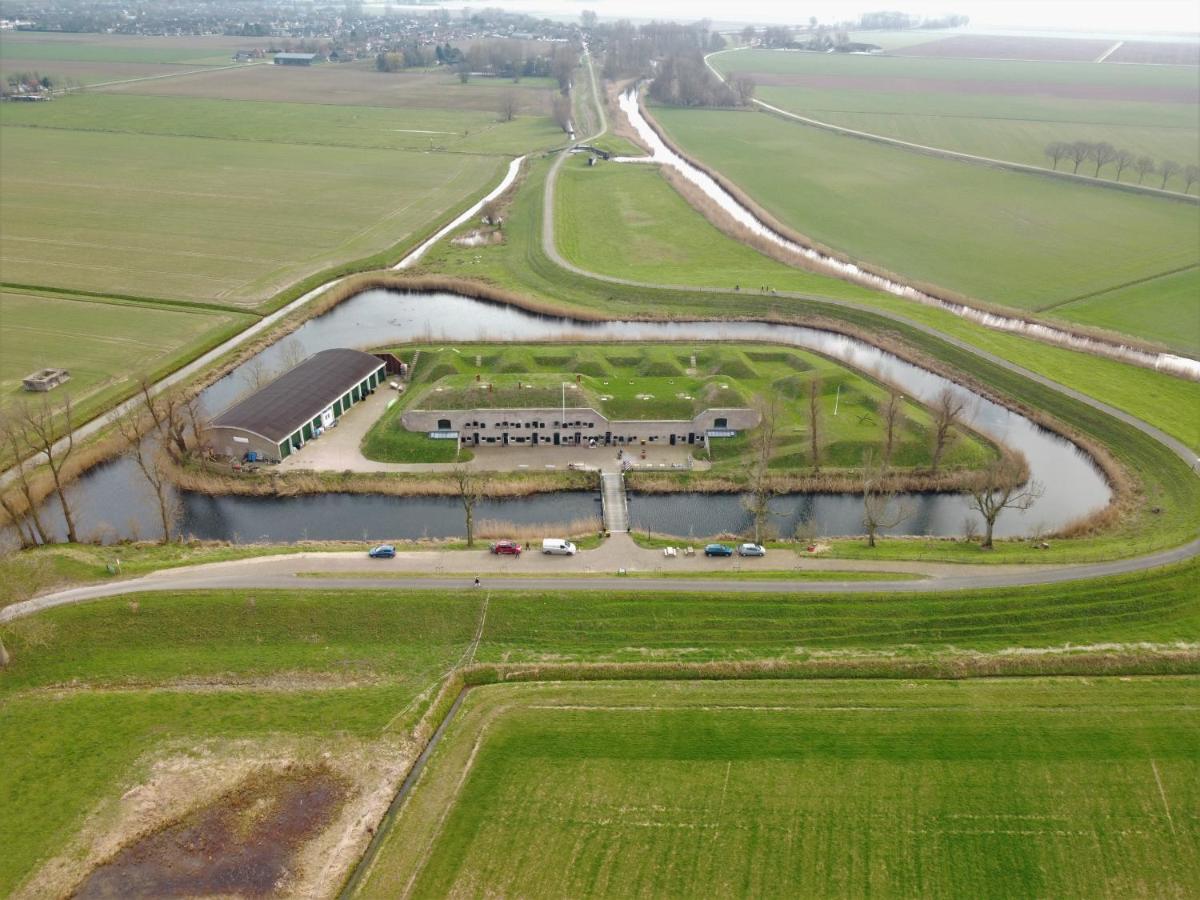 an aerial view of a park with a river at Bed & Breakfast Fort Bakkerskil in Nieuwendijk