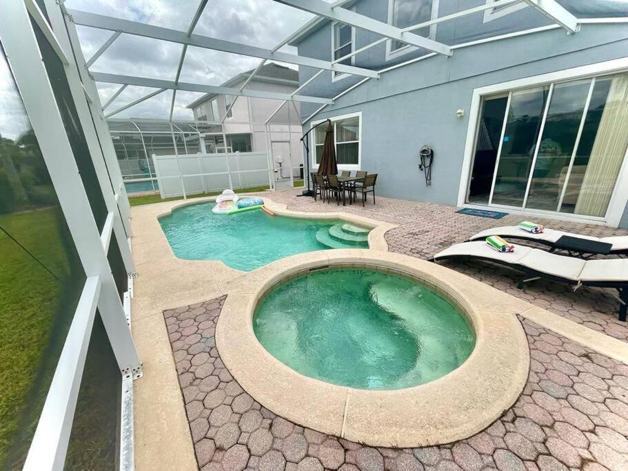 Heated swimming pool: Brand New Disney Villa Private Pool Hot Tub Pet Friendly Golf