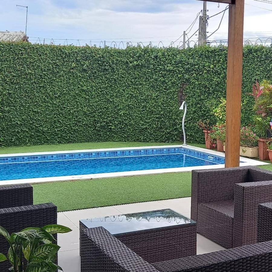 Rooftop swimming pool: Casa com piscina Caraguatatuba