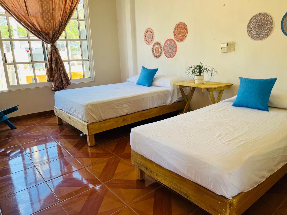 two beds in of the accommodations in Casa Karma