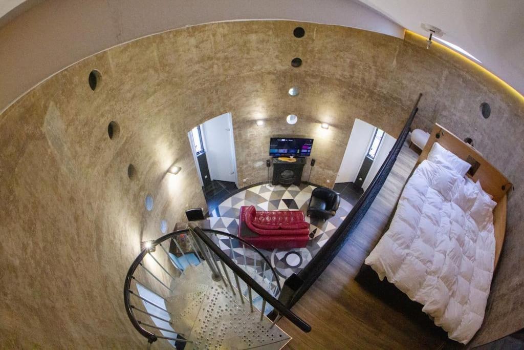 an overhead view of a spiral staircase in a house at Verblijf boven in de watertoren van Strijen met dakterras in Strijen