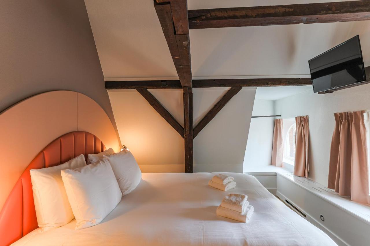 Een bed of bedden in een kamer bij Hotel Halbert