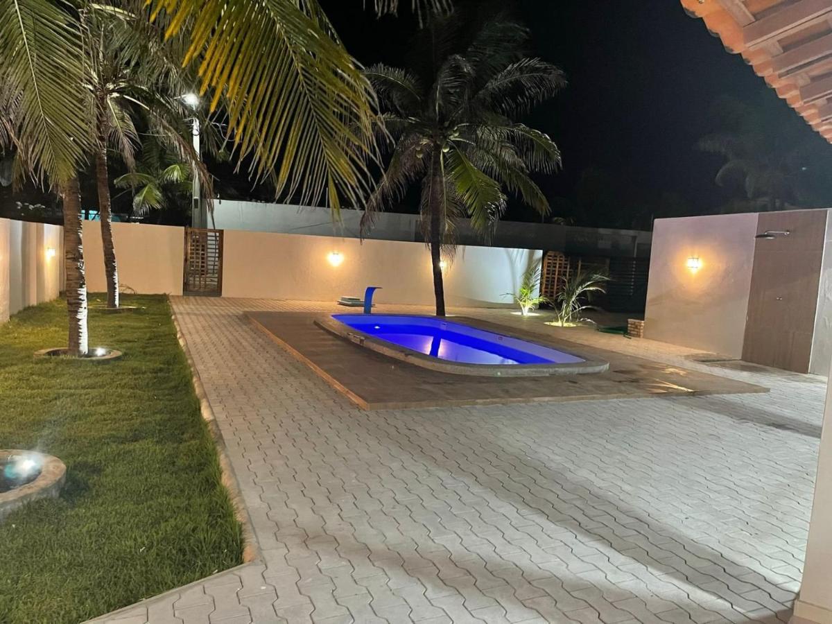 Casa nova, ampla, área de lazer com piscina e churrasqueira a 100mt da praia photo