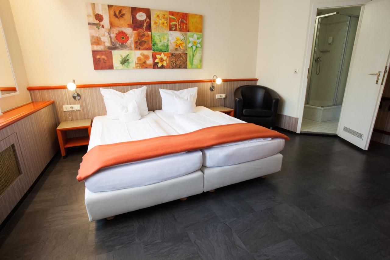 Een bed of bedden in een kamer bij Trip Inn Hotel Ariane