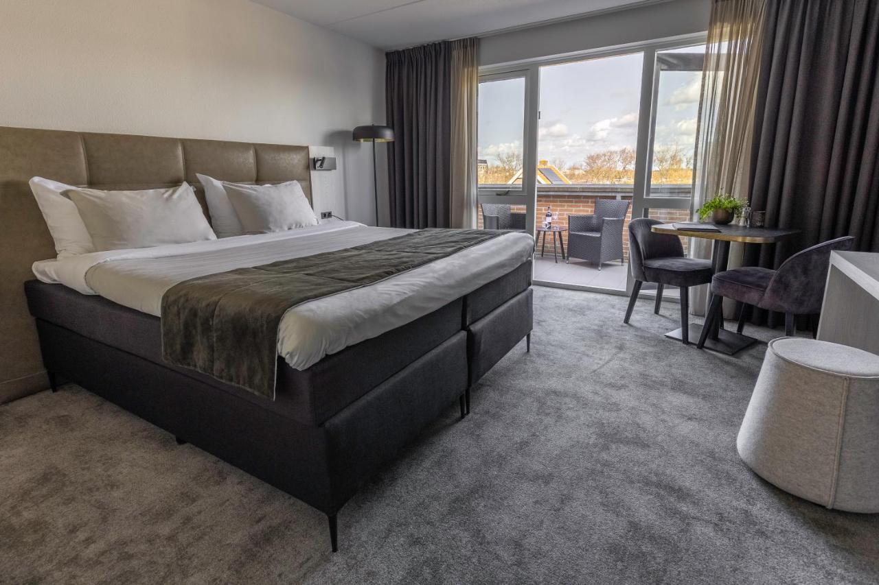 Een bed of bedden in een kamer bij Hotel Kogerstaete Texel