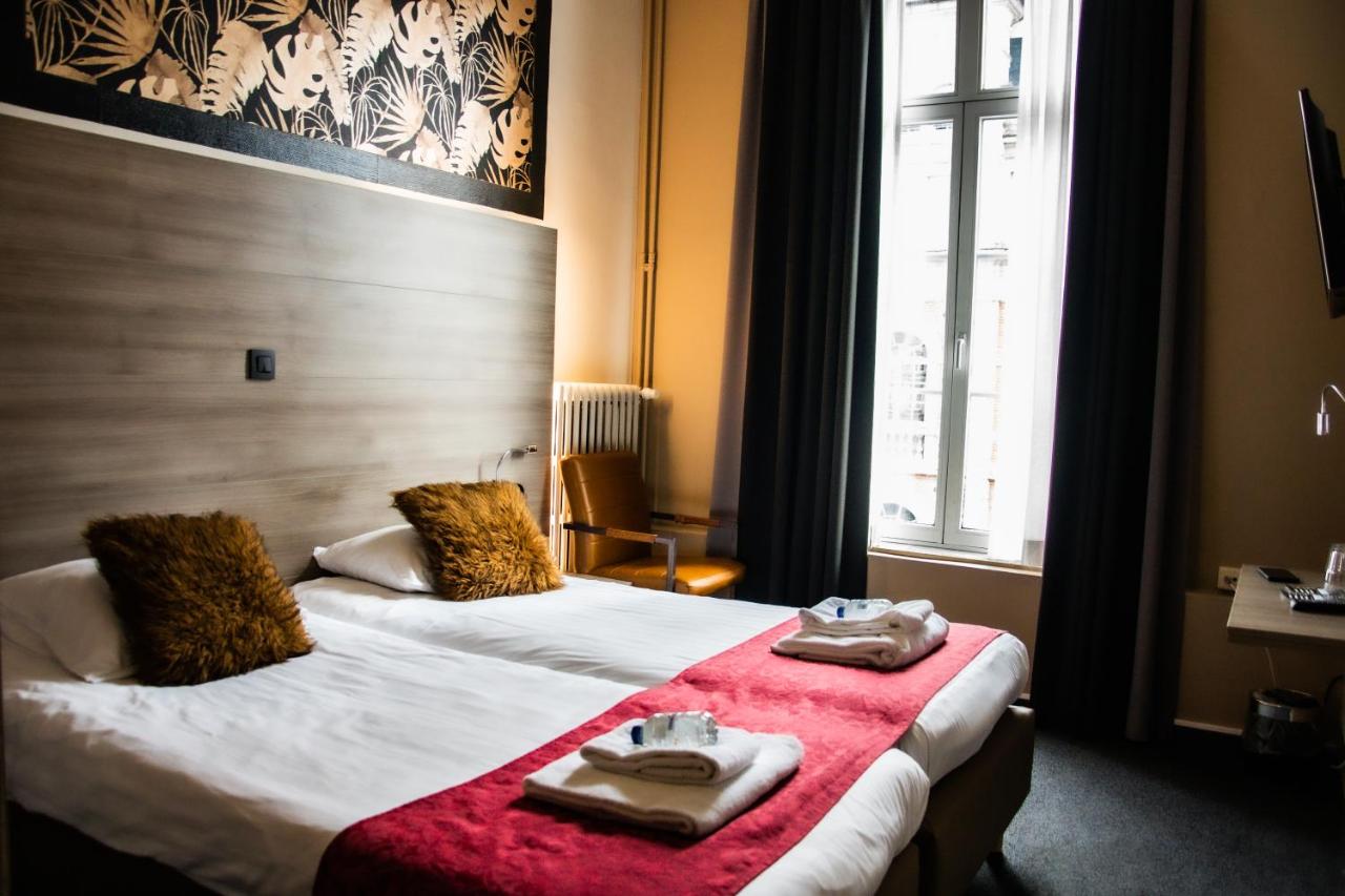 Een bed of bedden in een kamer bij Hotel Industrie