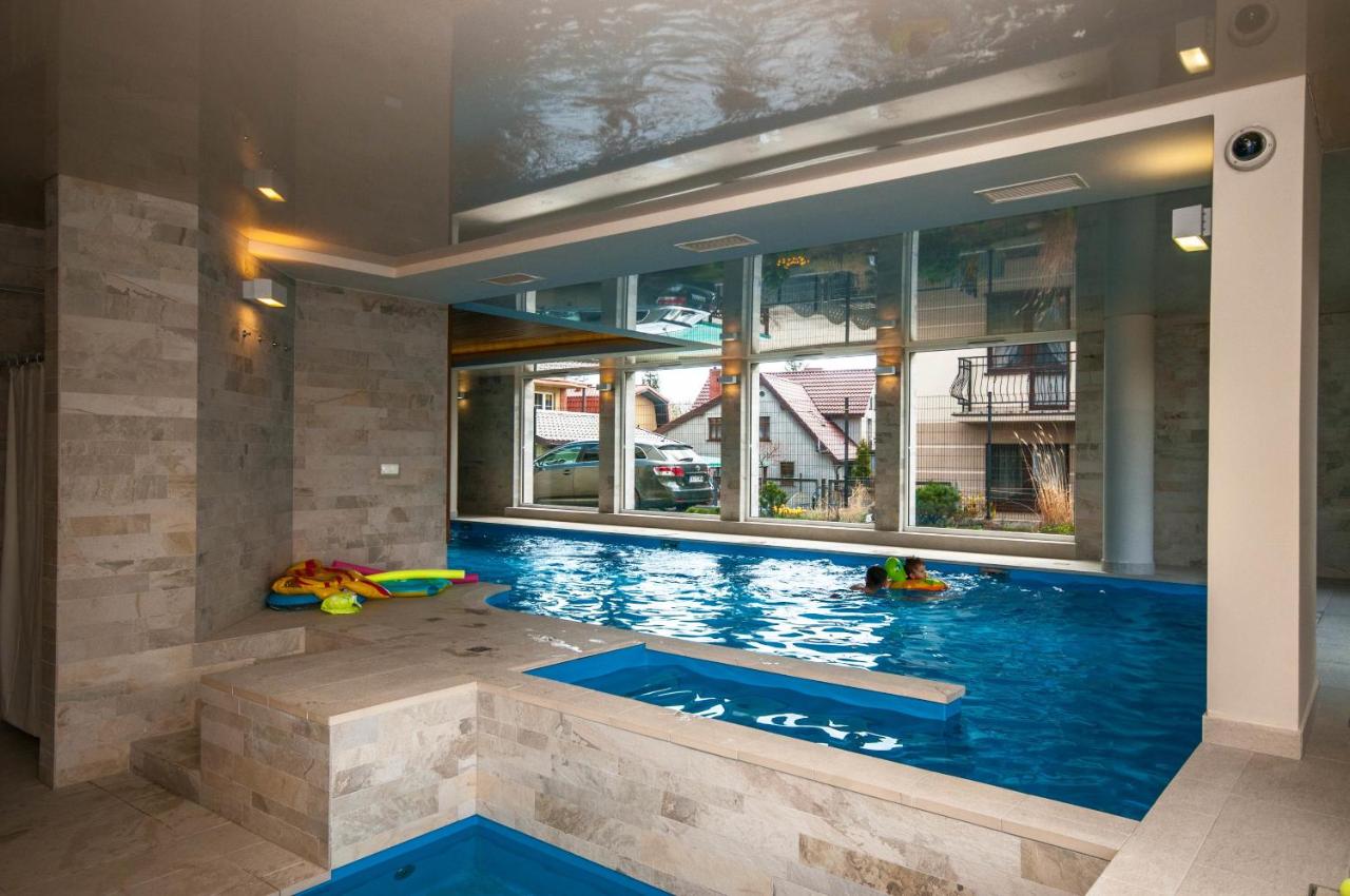 Heated swimming pool: Marina Jastarnia Apartamenty w budynku z Basenem