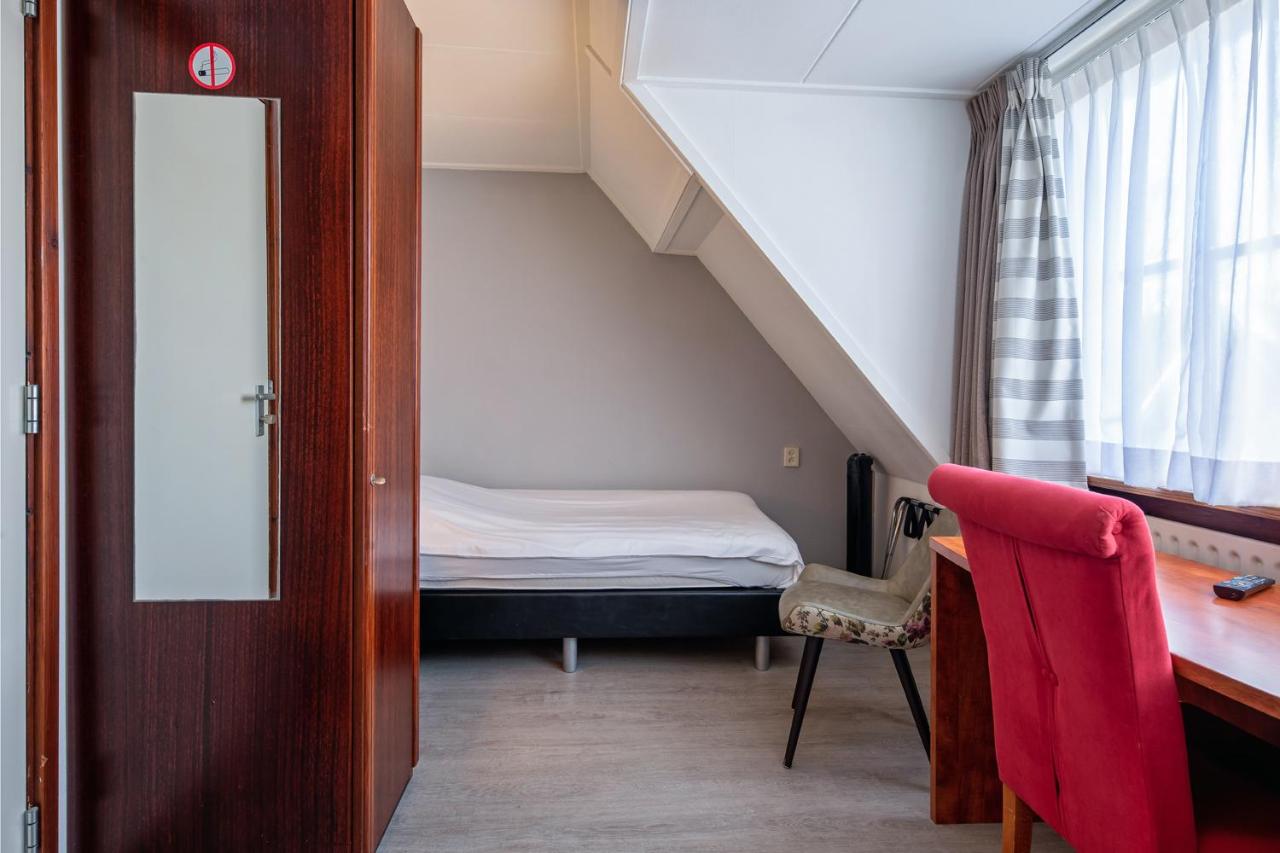 Een bed of bedden in een kamer bij B&B Hotel Rebecca