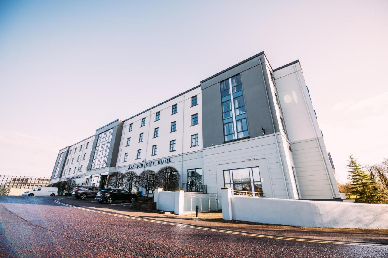 Armagh City Hotel exterior with parked cars on a clear day.