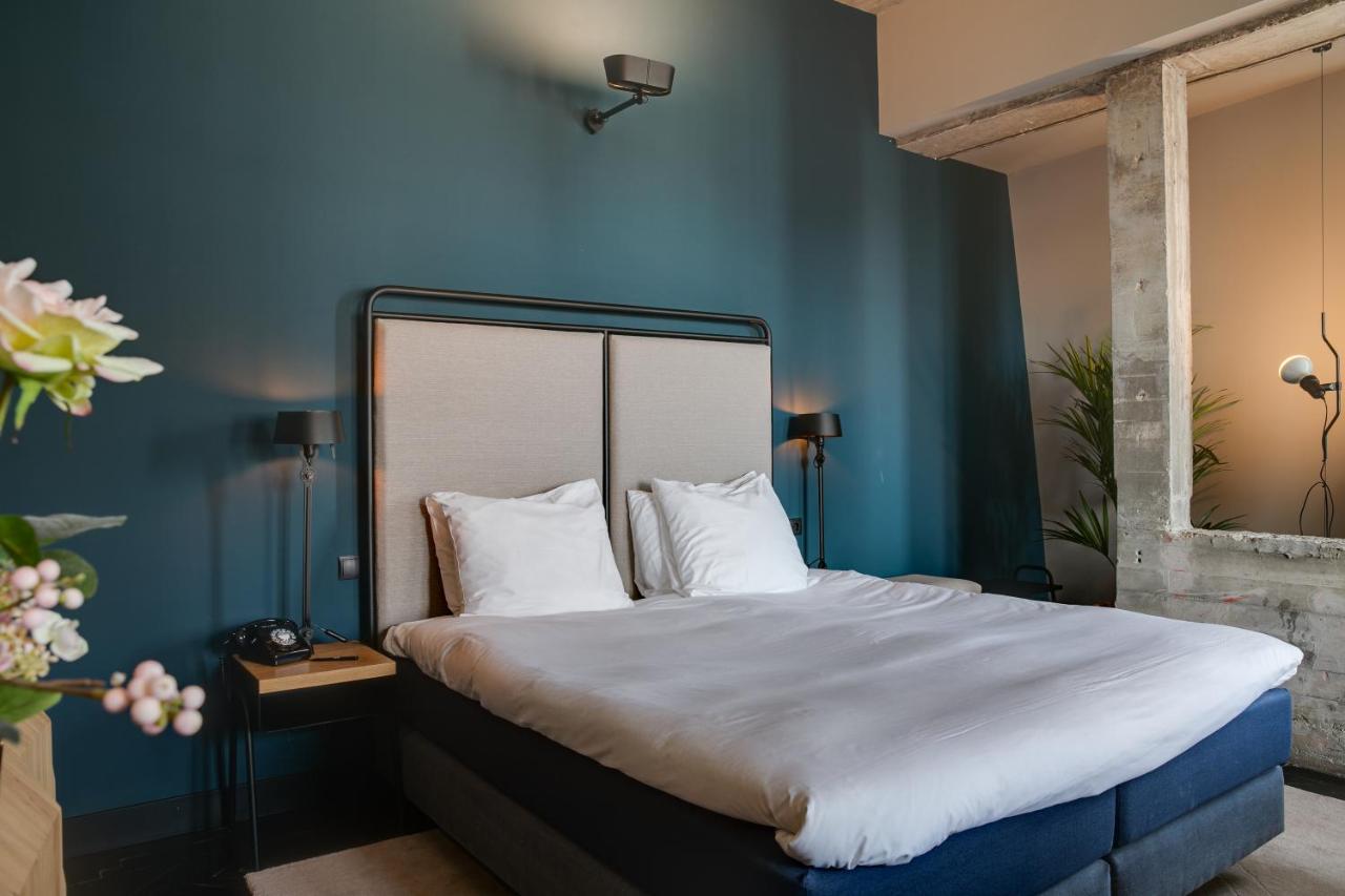 Een bed of bedden in een kamer bij The Duke Boutique Hotel