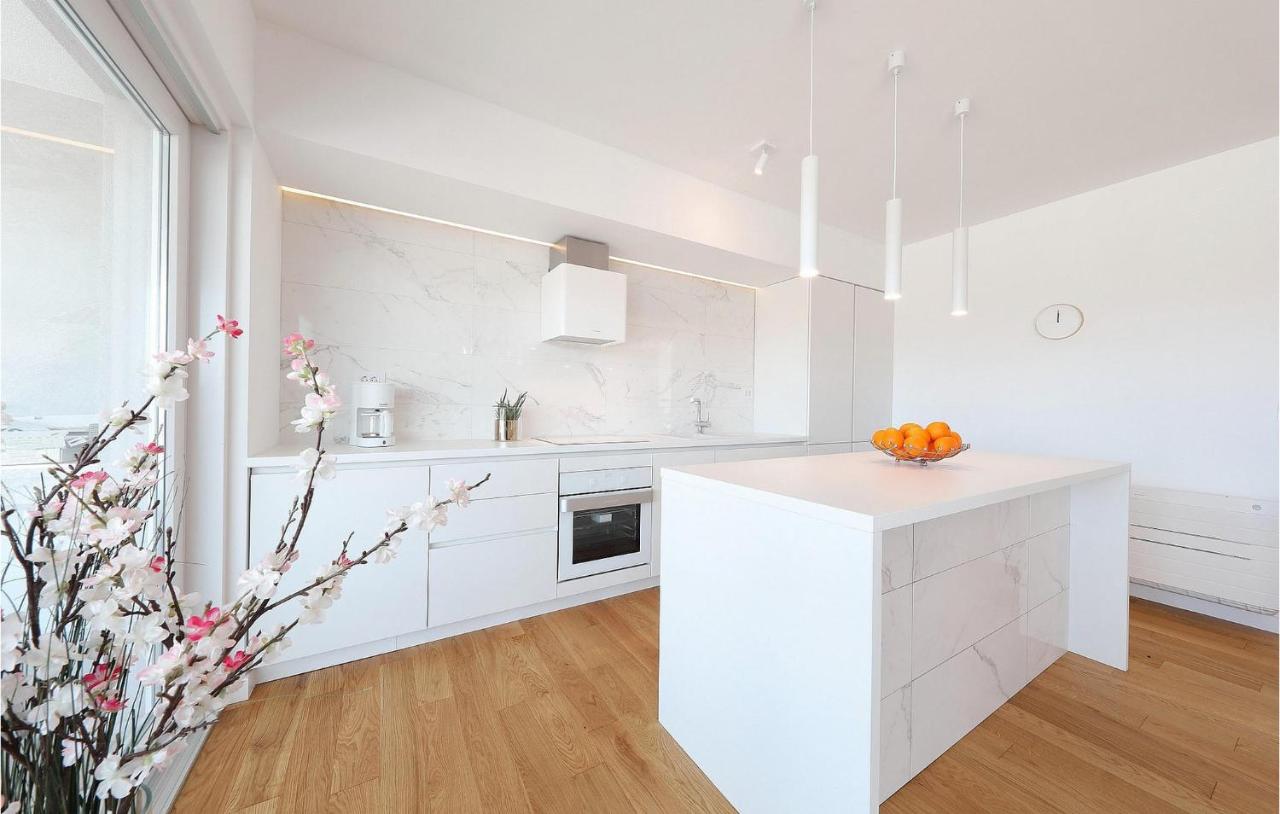 Fully equipped kitchen with clean-lined white cabinetry