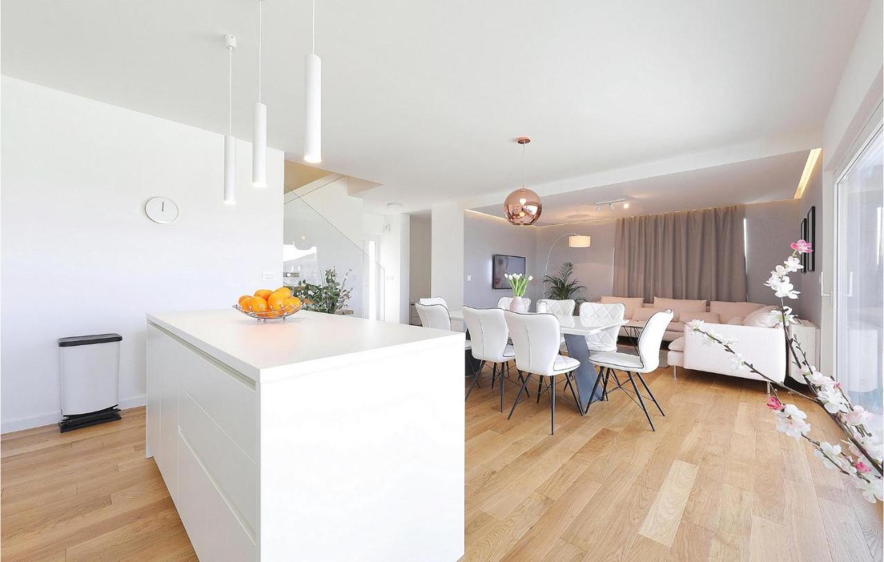 Open-plan kitchen and dining area inside Guarda Villa South