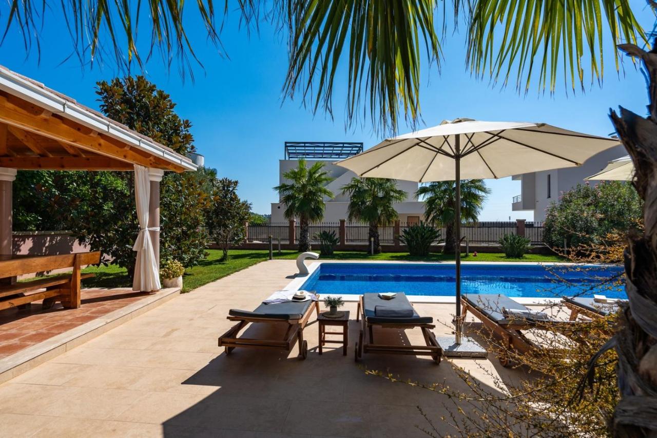Villa Antura with private heated 50sqm pool, 3 bedrooms, 3 bathrooms, and gym photo
