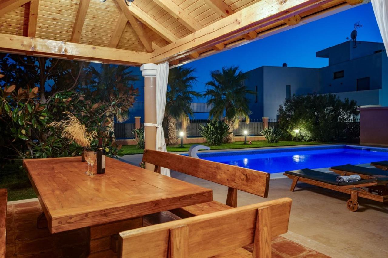 Villa Antura with private heated 50sqm pool, 3 bedrooms, 3 bathrooms, and gym photo