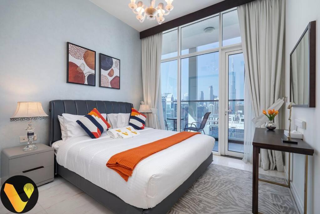 Vogue Vacation Homes, Business Bay, Bayz By Danube close to Downtown, Dubai Mall and Burj Khalifa, Three Bedroom Apartment with Balcony and Burj Khalifa view, Access to all Amenities - 5