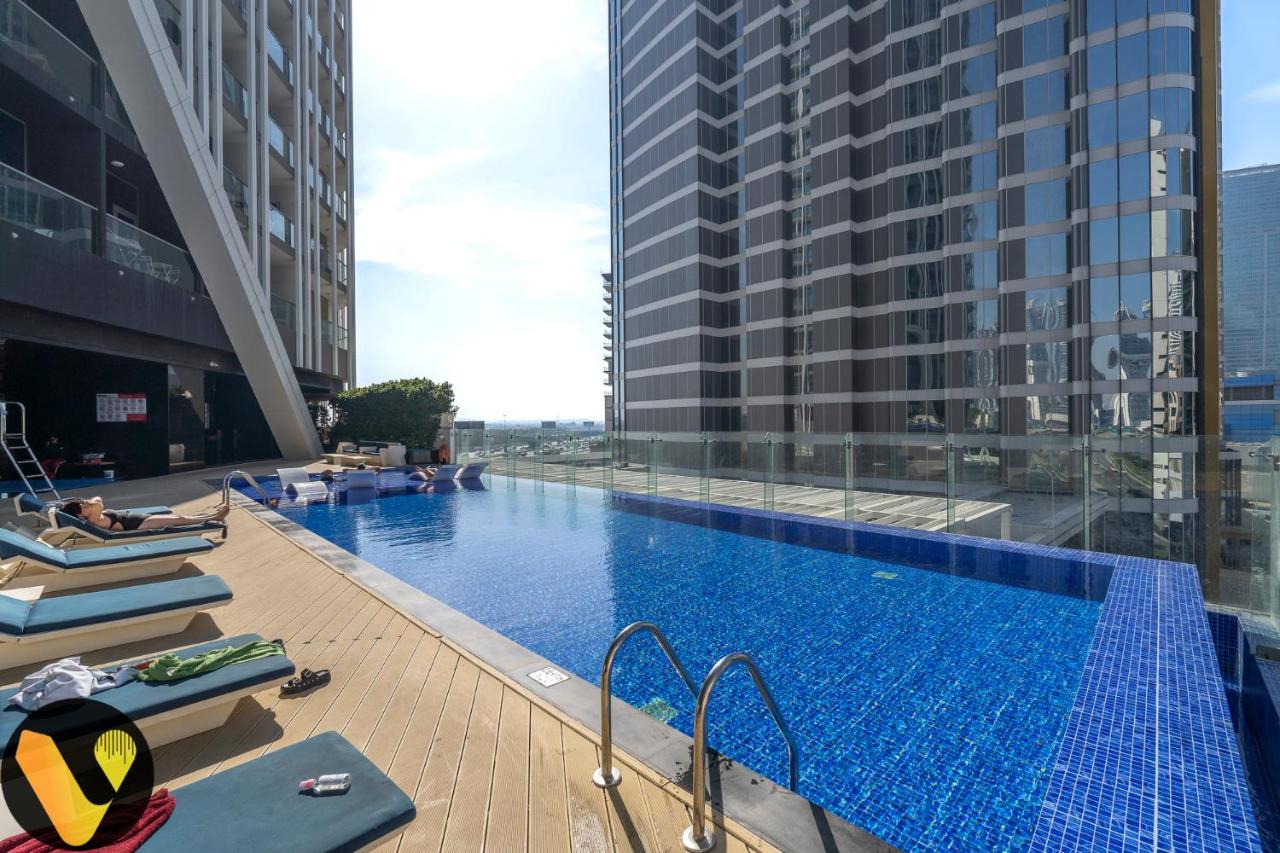 Vogue Vacation Homes, Business Bay, Bayz By Danube close to Downtown, Dubai Mall and Burj Khalifa, Three Bedroom Apartment with Balcony and Burj Khalifa view, Access to all Amenities - 3