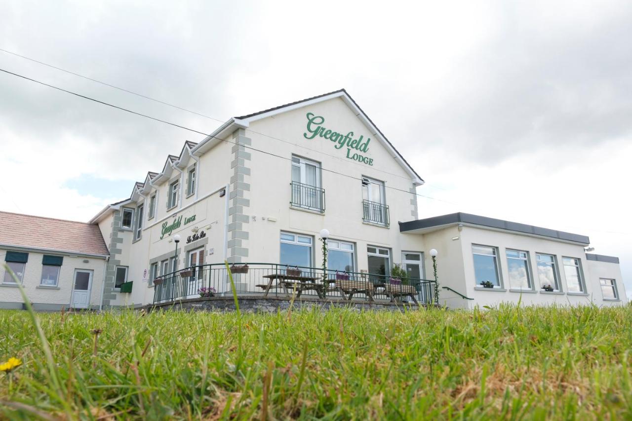 Exterior view of Greenfield Lodge with grass in the foreground.
