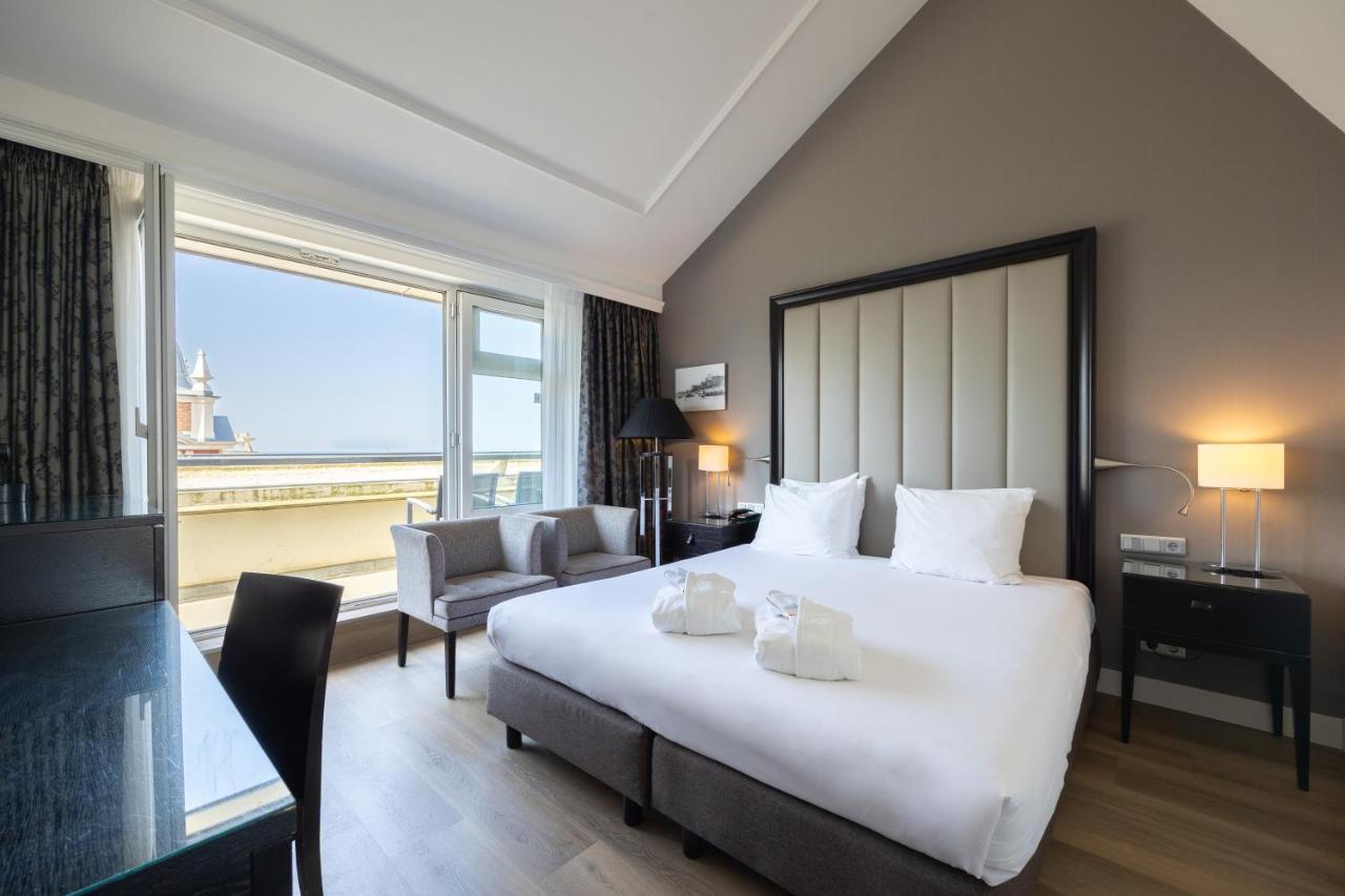 Een bed of bedden in een kamer bij Grand Hotel Amrâth Kurhaus The Hague Scheveningen