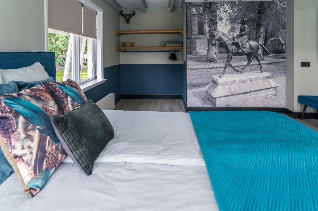 Een bed of bedden in een kamer bij De Juffer van Batinghe